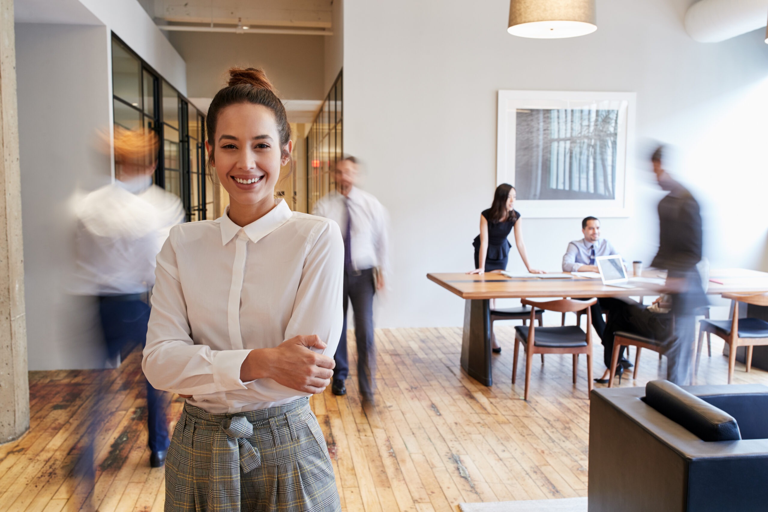 Portrait,Of,Young,White,Woman,In,A,Busy,Modern,Workplace